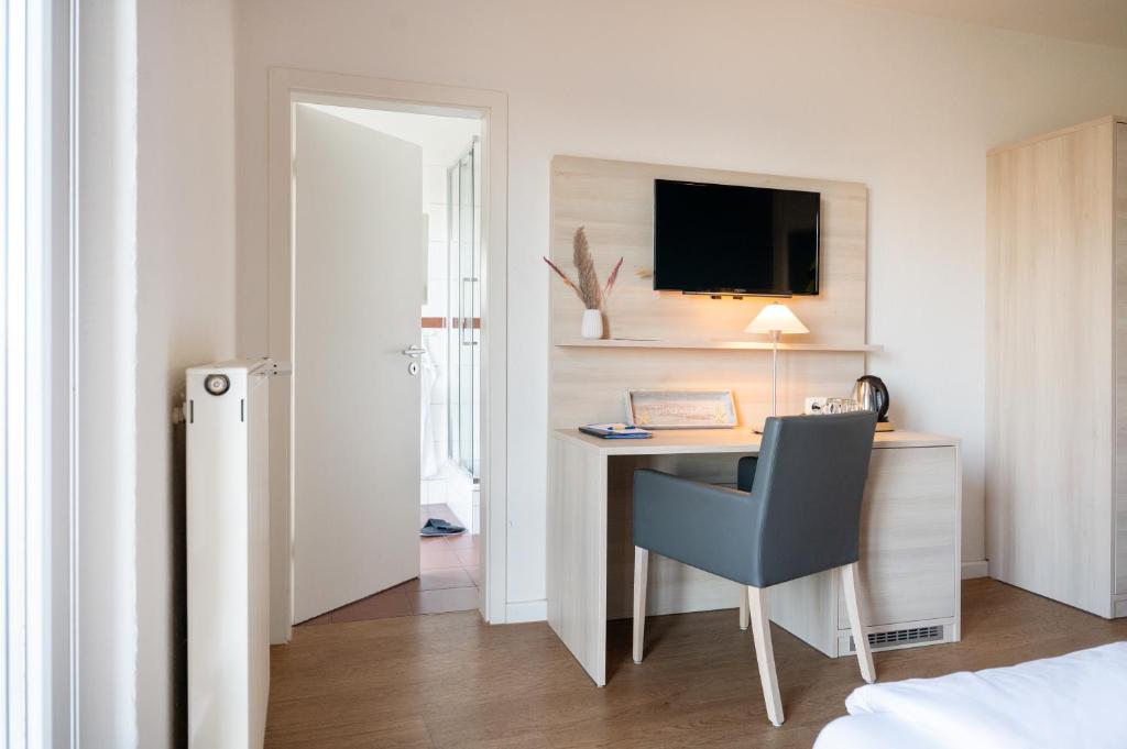 TV a/nebo společenská místnost v ubytování Hotel Alte Fischereischule