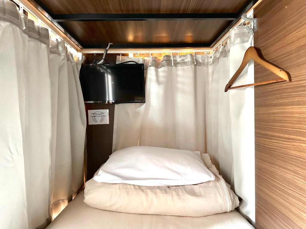 Postel nebo postele na pokoji v ubytování A16 HOSTEL TOKYO