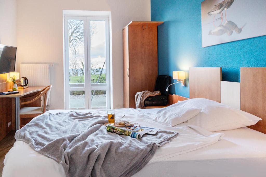 Postel nebo postele na pokoji v ubytování Hotel Alte Fischereischule