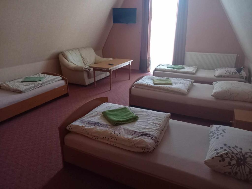 Postel nebo postele na pokoji v ubytování Miltex