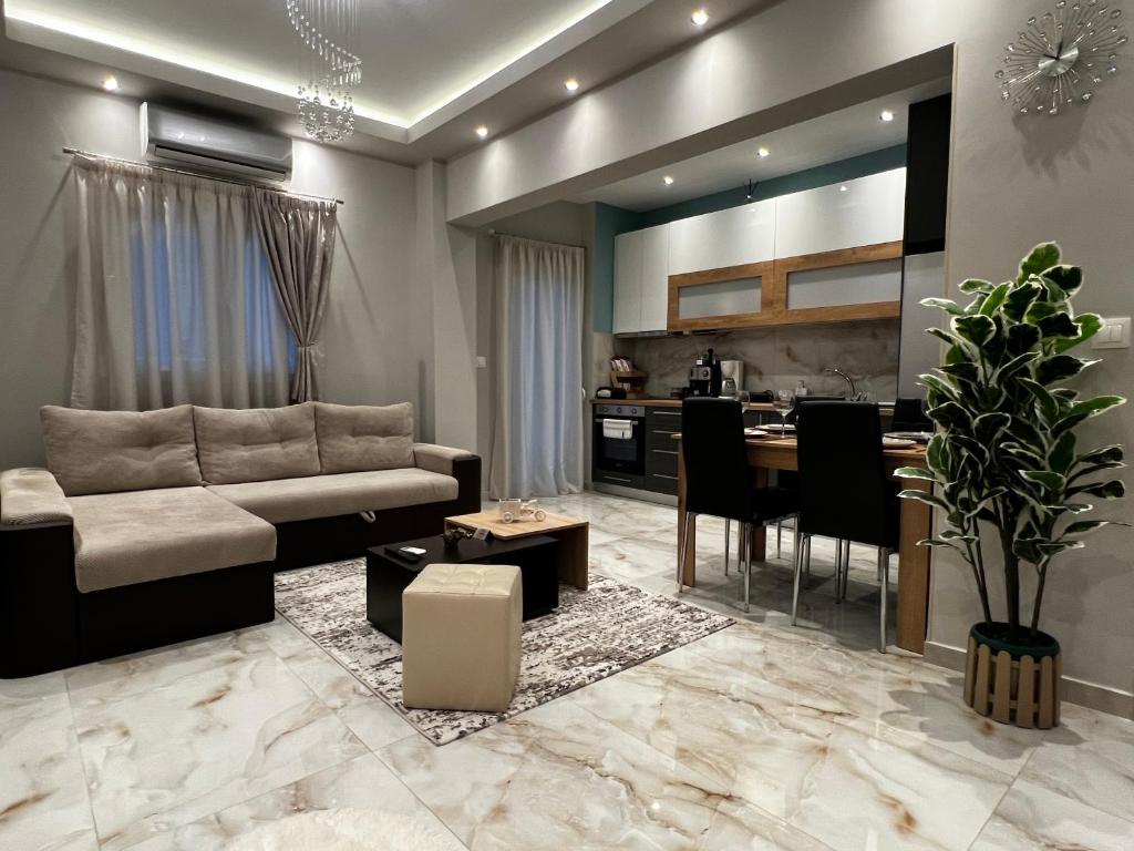 a living room with a couch and a table at Diamond in Thessaloniki