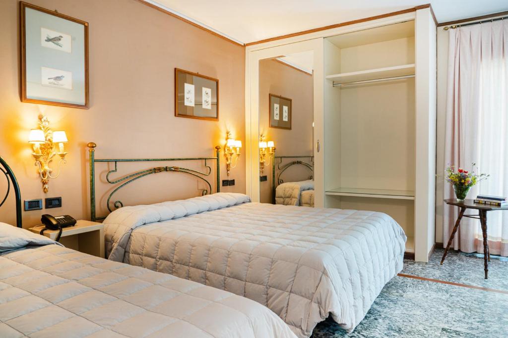 Postel nebo postele na pokoji v ubytování Hotel Daniel