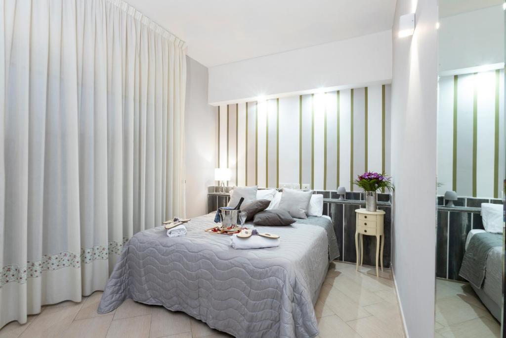 a bedroom with a bed with a table on it at Hotel San Paolo in Naples