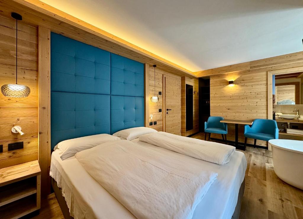 Letto o letti in una camera di Dolomiti Luxury Mountain View BIKE FRIENDLY