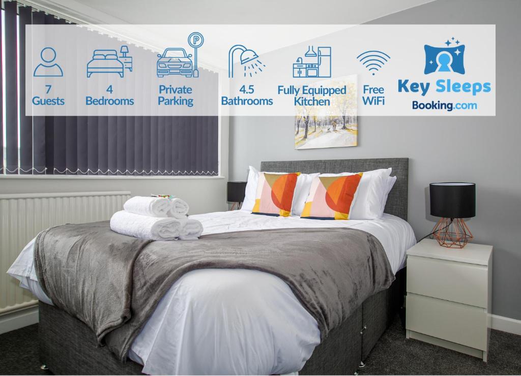 a bedroom with a bed with many signs on the wall at Large Property & Contractors & Families & Garden & En-Suite in Rockingham
