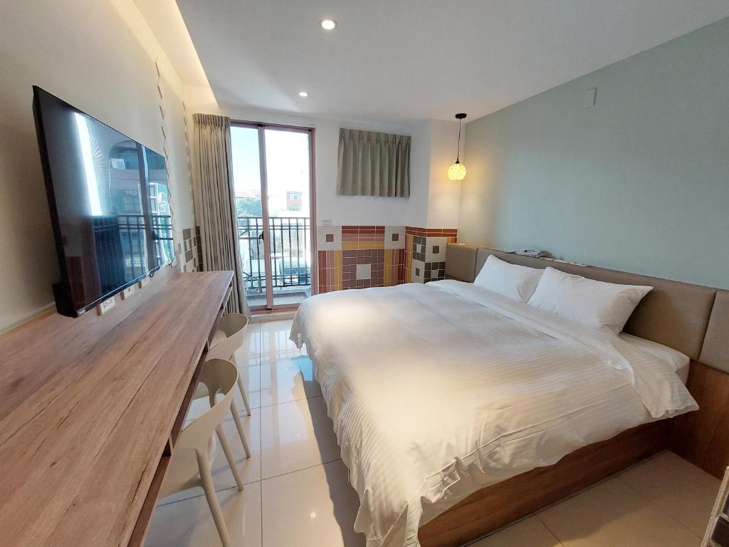 Postel nebo postele na pokoji v ubytování 安平商旅Choona Hotel Anping