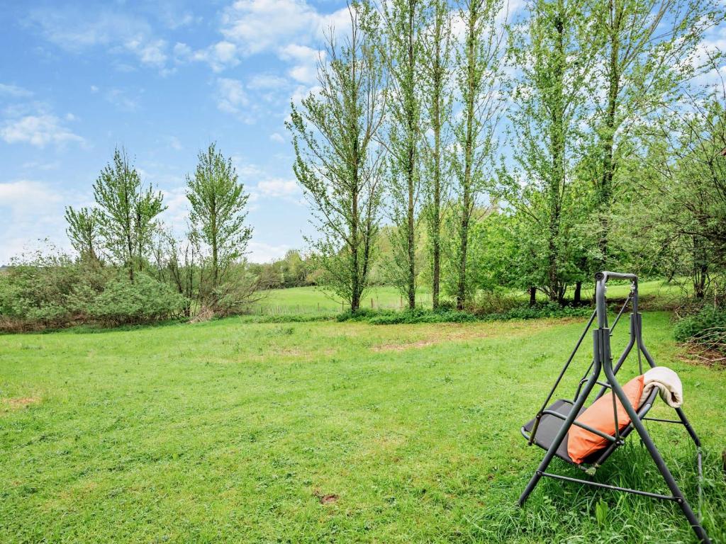 a swing in the middle of a grassy field at 1 Bed in Coleford 91373 in Bream