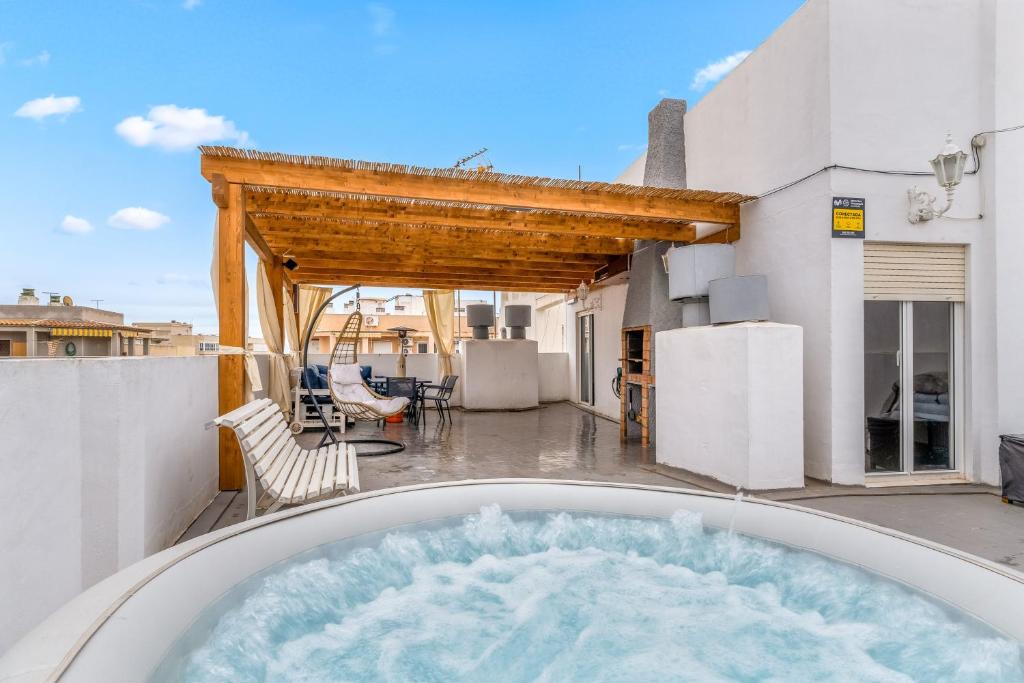 a hot tub on the balcony of a house at Mar Báltico in Torrevieja