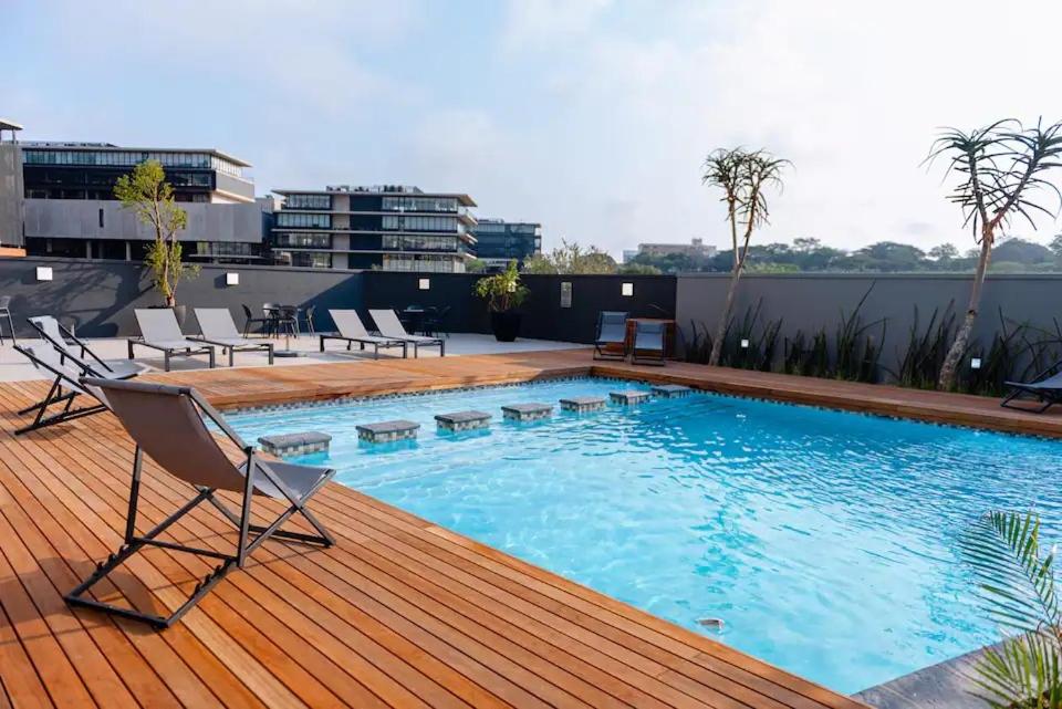 a swimming pool on the roof of a building at 135 on Millennial Umhlanga in Durban