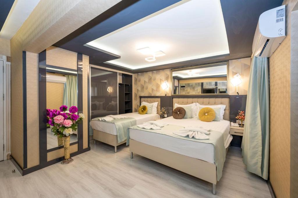 Postel nebo postele na pokoji v ubytování Grand Ons Hotel