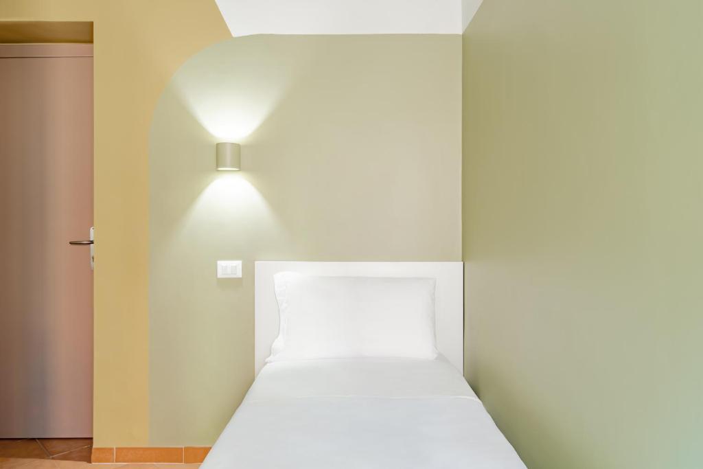 Postel nebo postele na pokoji v ubytování Hotel Infinito - Gruppo BLAM HOTELS