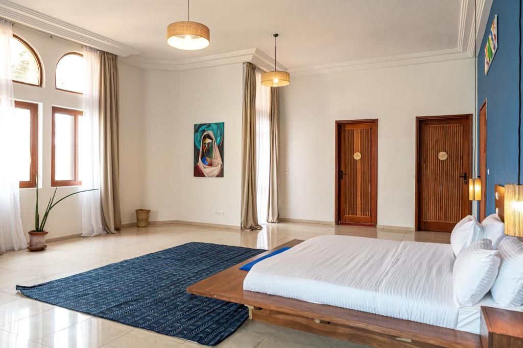 Postel nebo postele na pokoji v ubytování Tamarin Hôtel Cotonou