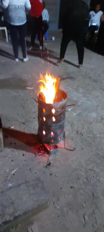 a fire in a bucket on the street at Maara Lodge Chogoria in Igoji
