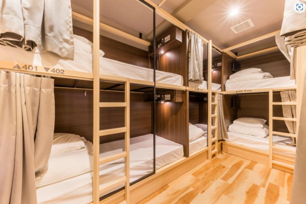 Postel nebo postele na pokoji v ubytování A16 HOSTEL TOKYO