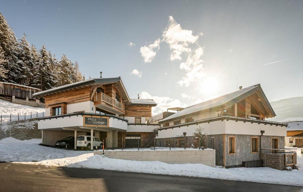 a house in the snow in front at Holzlodge deluxe in Radstadt