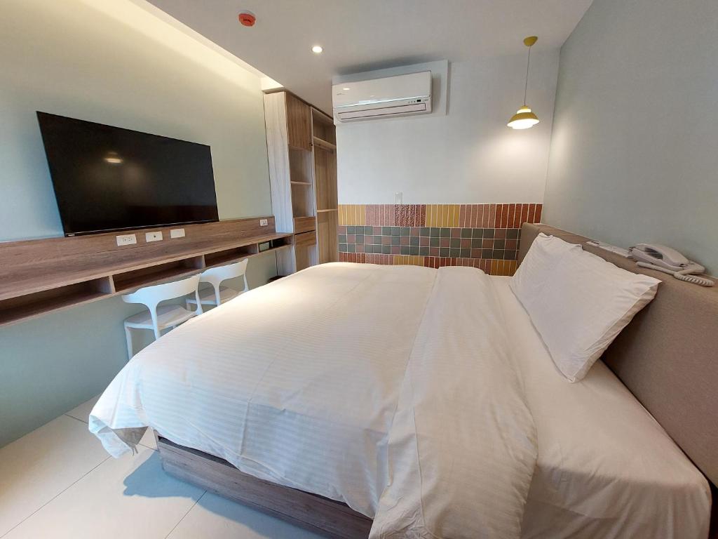 Postel nebo postele na pokoji v ubytování 安平商旅Choona Hotel Anping
