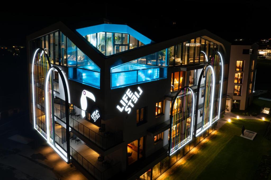 an aerial view of a building at night at Lifesteil Aparthotel in Umhausen
