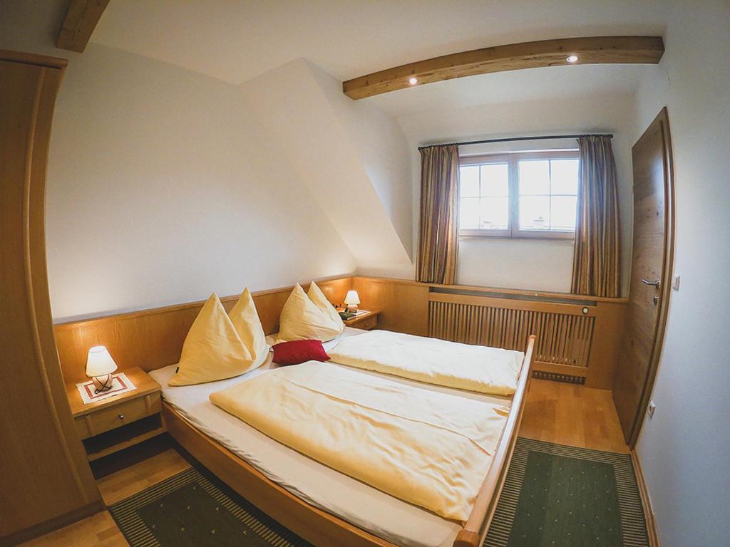 A bed or beds in a room at Appartements Macheiner