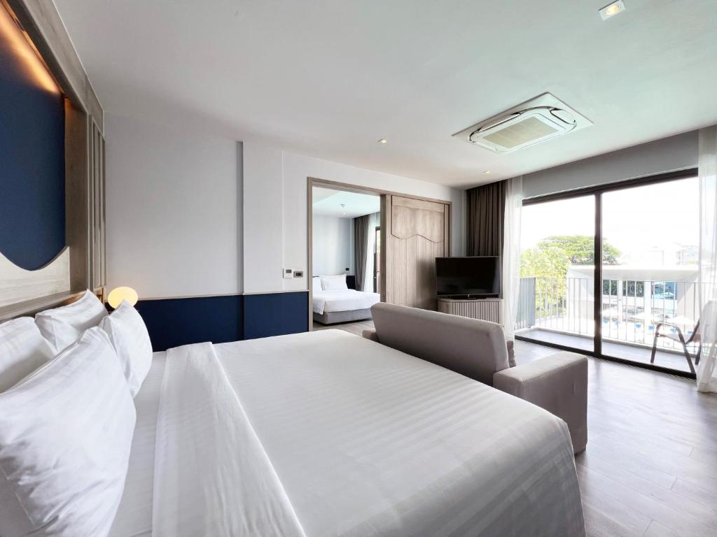 Postel nebo postele na pokoji v ubytování Seabed Grand Hotel Phuket - SHA Extra Plus