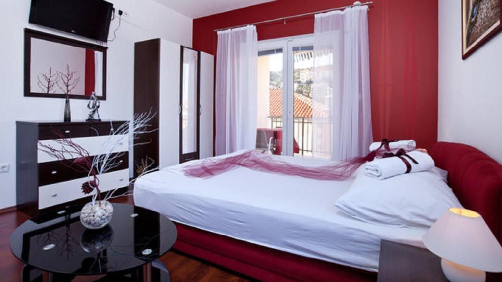Posteľ alebo postele v izbe v ubytovaní Apartments Villa Aura - Adult Only
