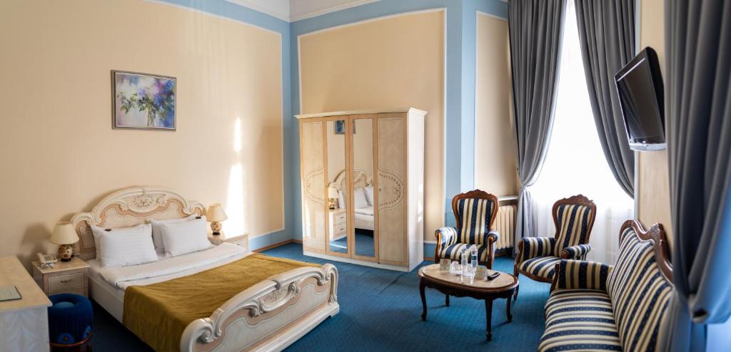 Postel nebo postele na pokoji v ubytování George Hotel