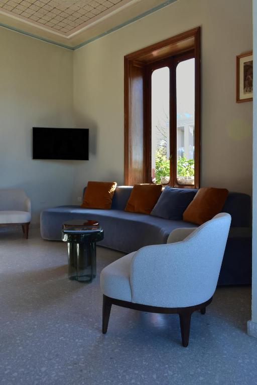 TV a/nebo společenská místnost v ubytování Villa Pioppi Hotel