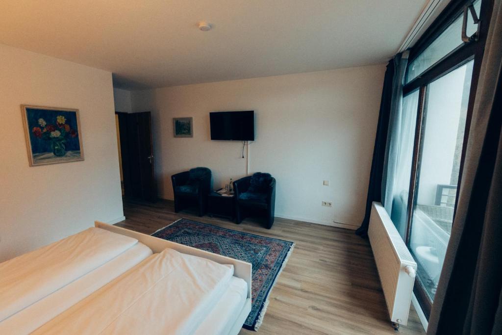 Postel nebo postele na pokoji v ubytování Gasthof Hotel zur Post