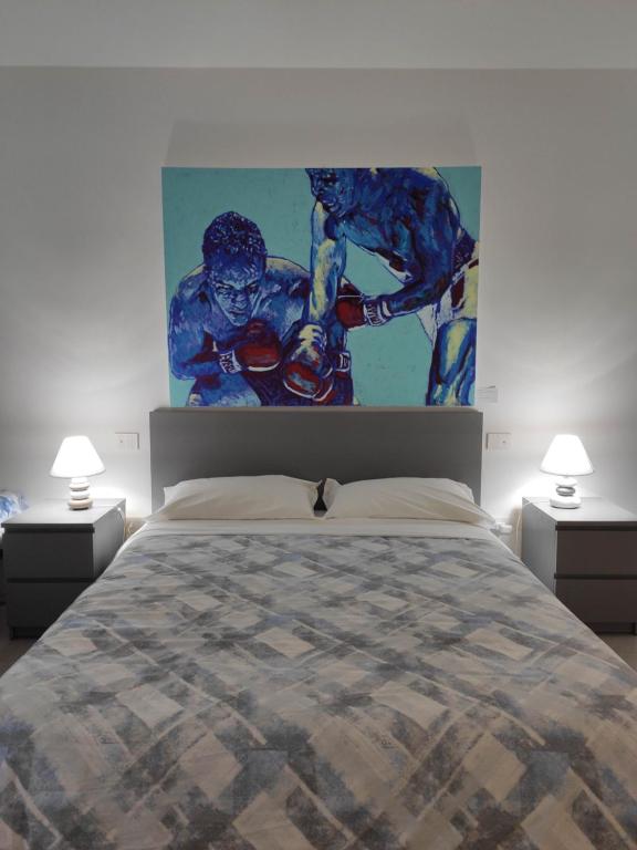Postel nebo postele na pokoji v ubytování GArt Riviera B&B