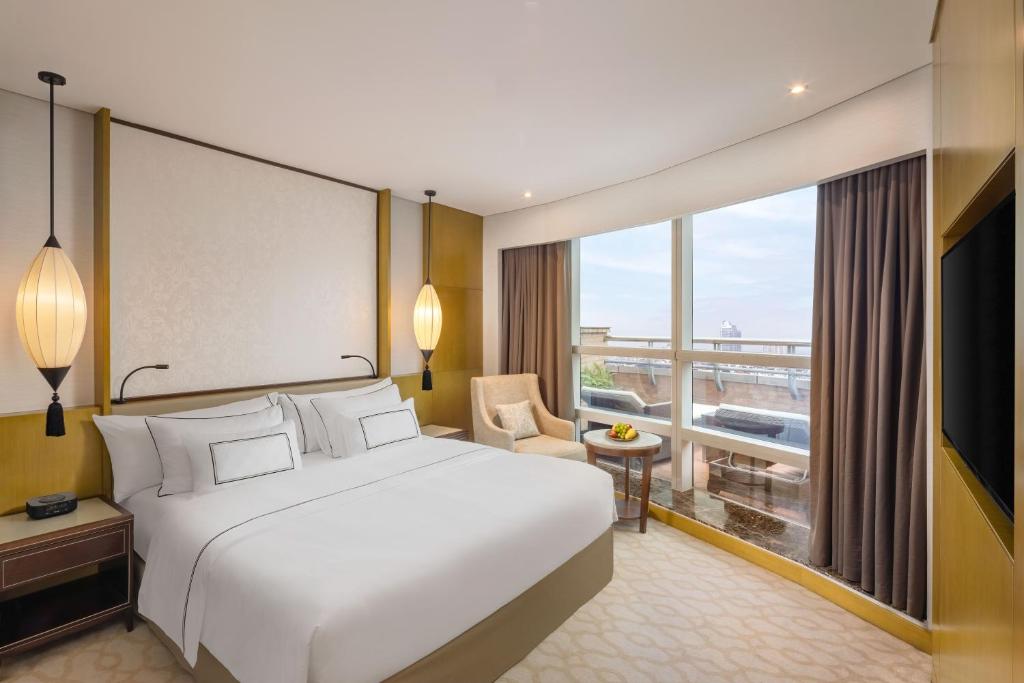 Postel nebo postele na pokoji v ubytování Melia Hanoi