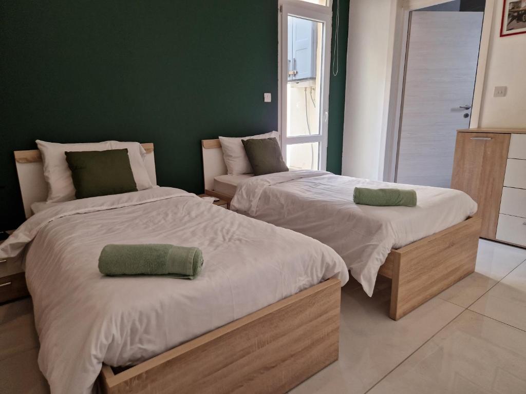 Postel nebo postele na pokoji v ubytování District