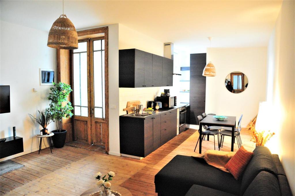 TV a/nebo společenská místnost v ubytování Boho Apartments - 2 Bedrooms