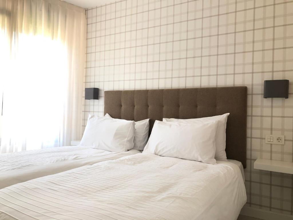 Postel nebo postele na pokoji v ubytování Apartamentos Las Vegas