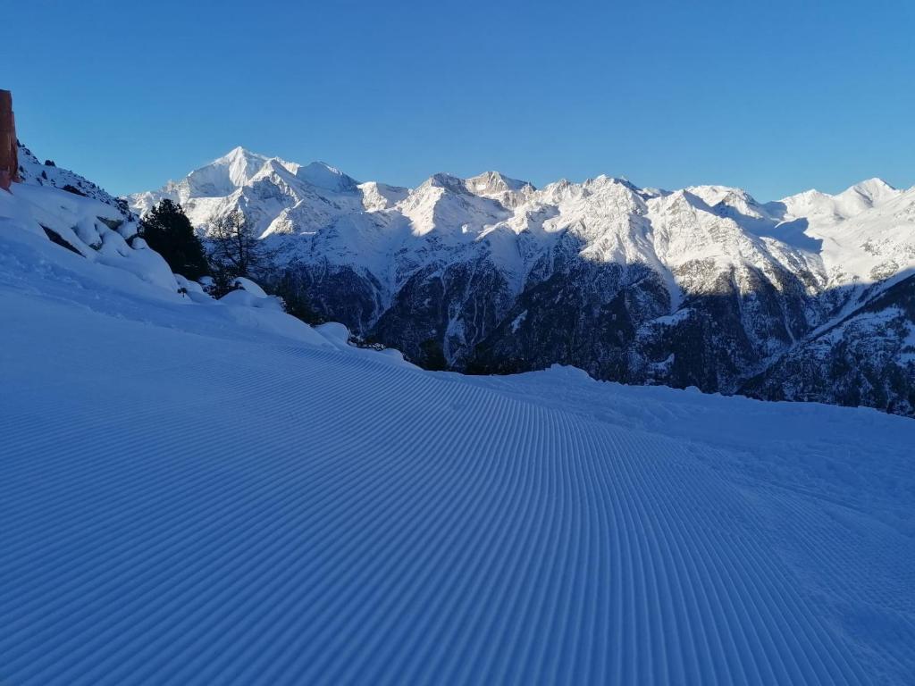 a snow covered mountain range with snow covered mountains at Gaby in Grächen