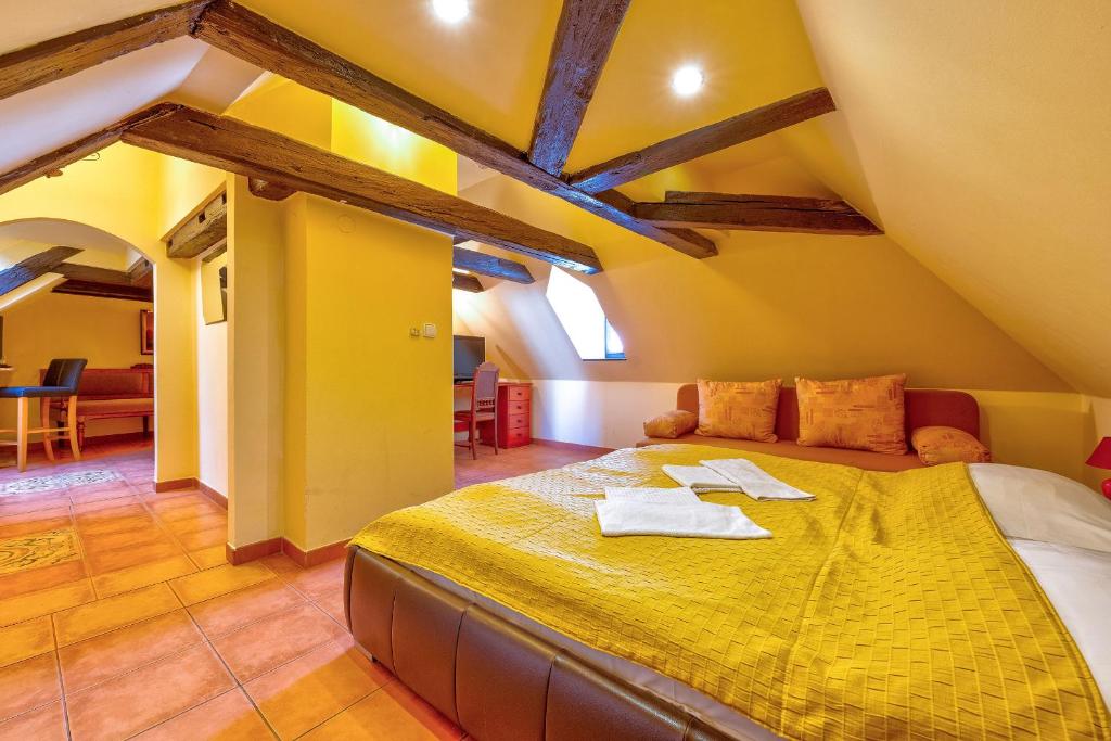 Postel nebo postele na pokoji v ubytování Betlem Club Hotel