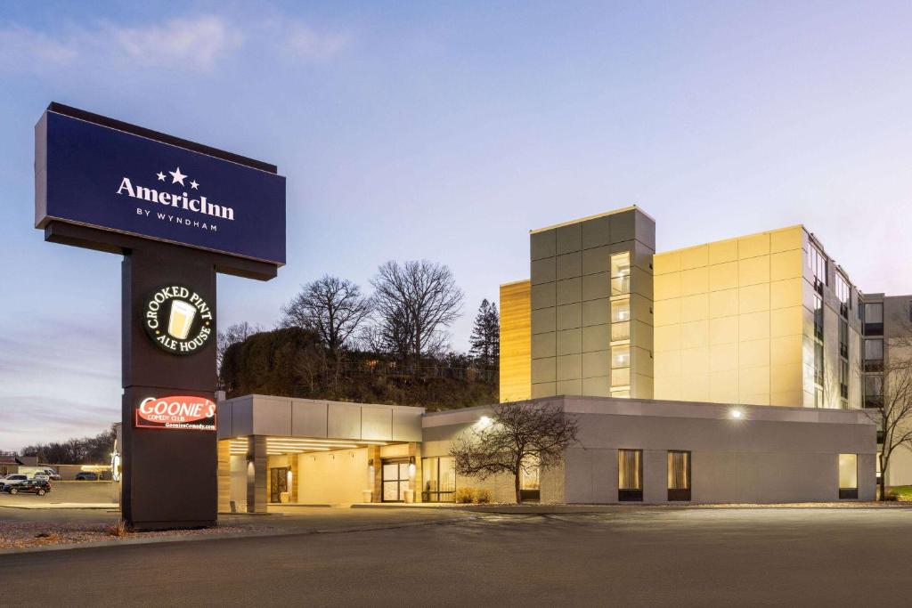 a building with a sign in front of it at AmericInn by Wyndham Rochester Near Mayo Clinic in Rochester