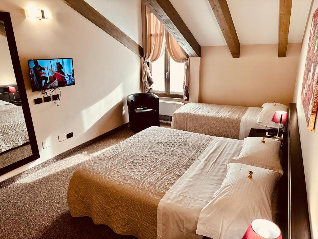 Postel nebo postele na pokoji v ubytování Hotel Malpensa INN Aereoporto