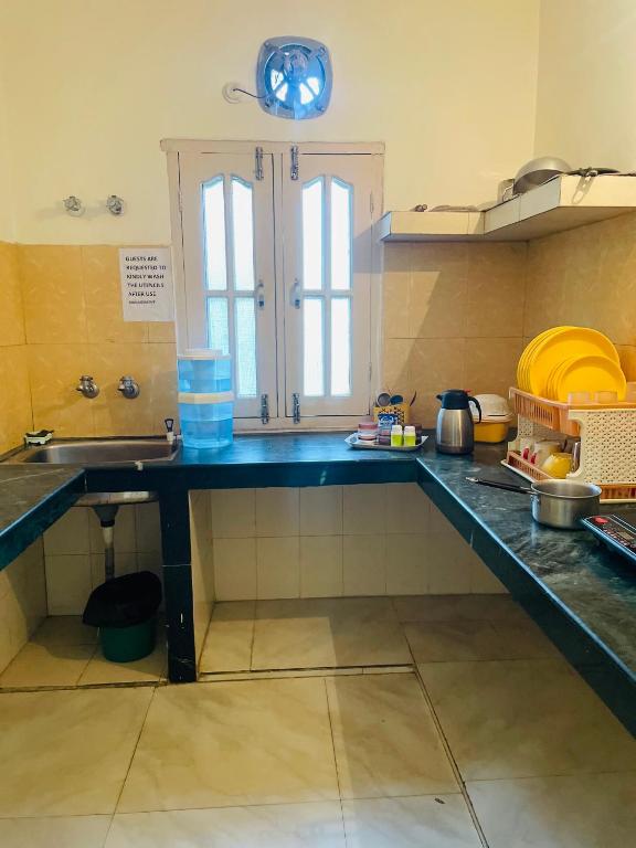 a kitchen with a sink and a counter top at Wonder homes in Chhota Simla