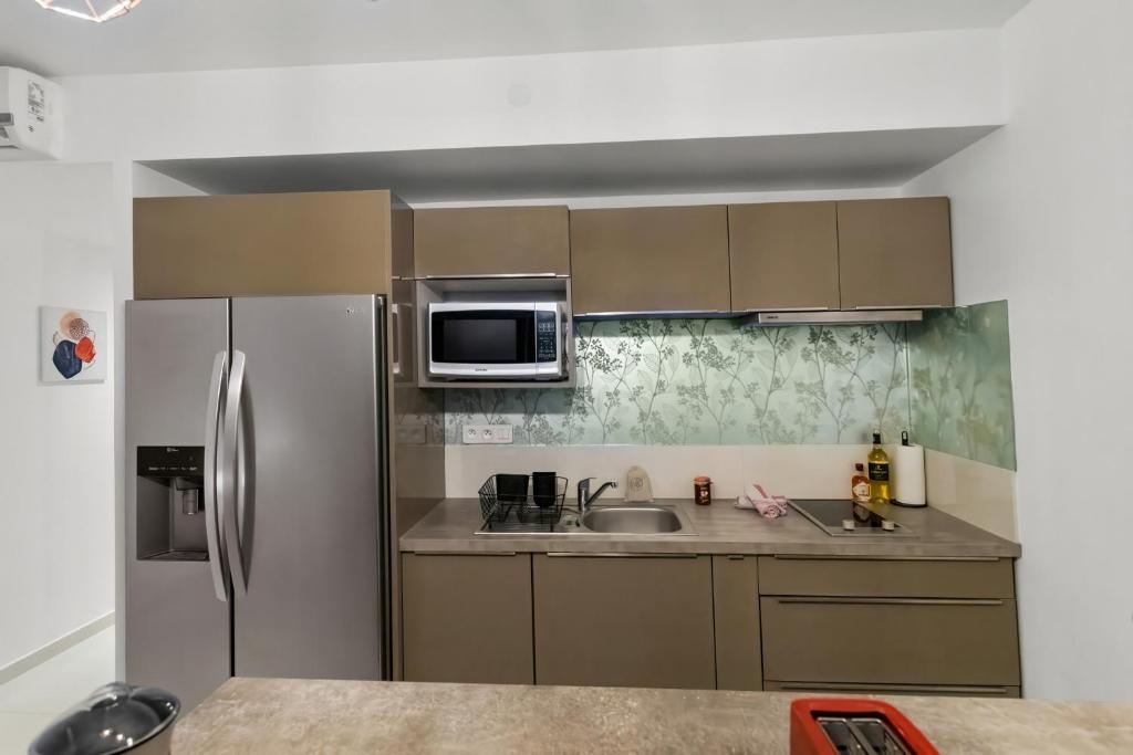 Kuchyň nebo kuchyňský kout v ubytování Vue époustouflante sur le lagon pour 4p
