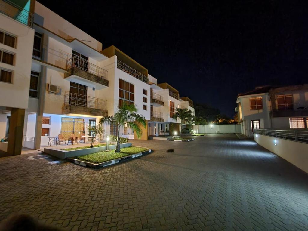 an empty courtyard of a building at night at Ary Homestay Nyali- Behind City Mall in Nyali