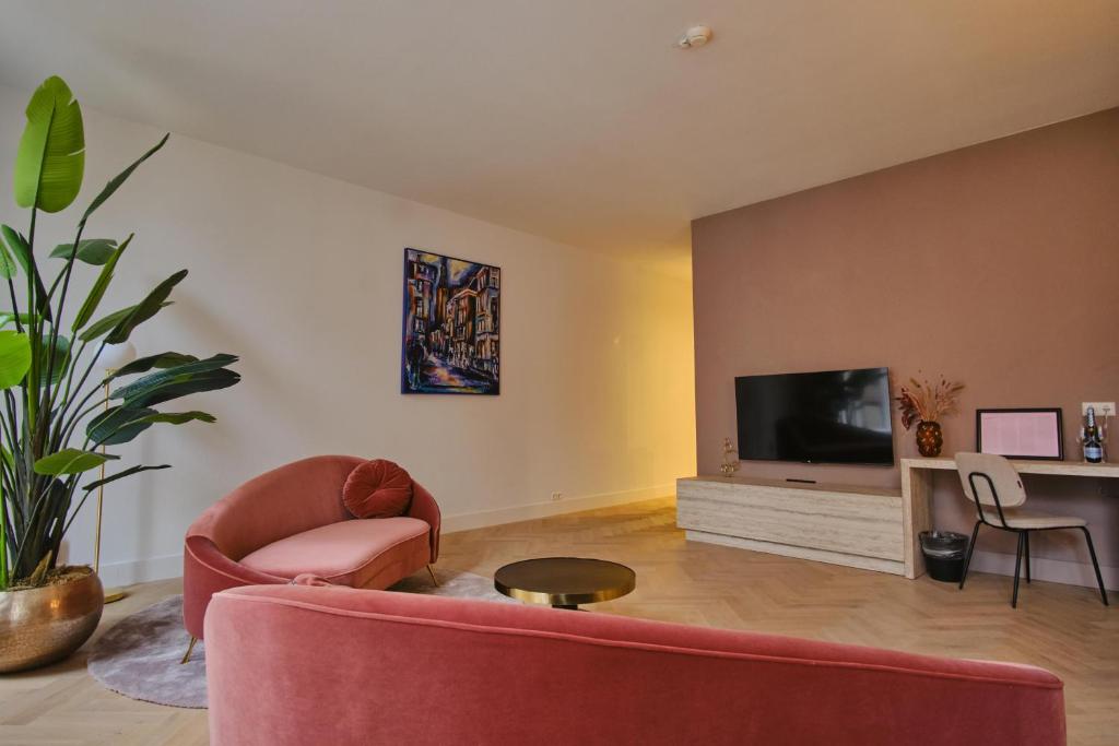 TV a/nebo společenská místnost v ubytování Hotel Halbert