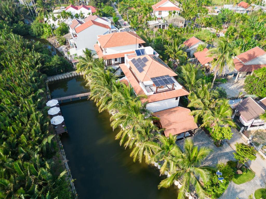 an aerial view of a house with palm trees at Mayci Boutique Hotel Hoi An in Hoi An