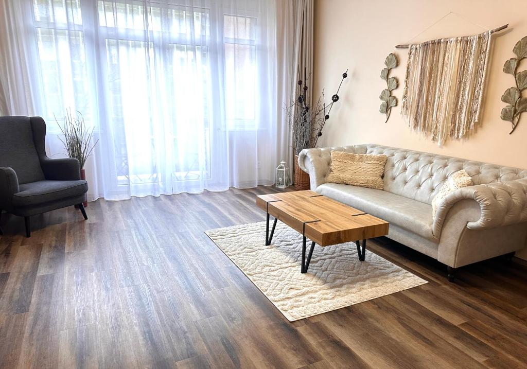 a living room with a couch and a coffee table at Eva's Apartment Prague in Prague