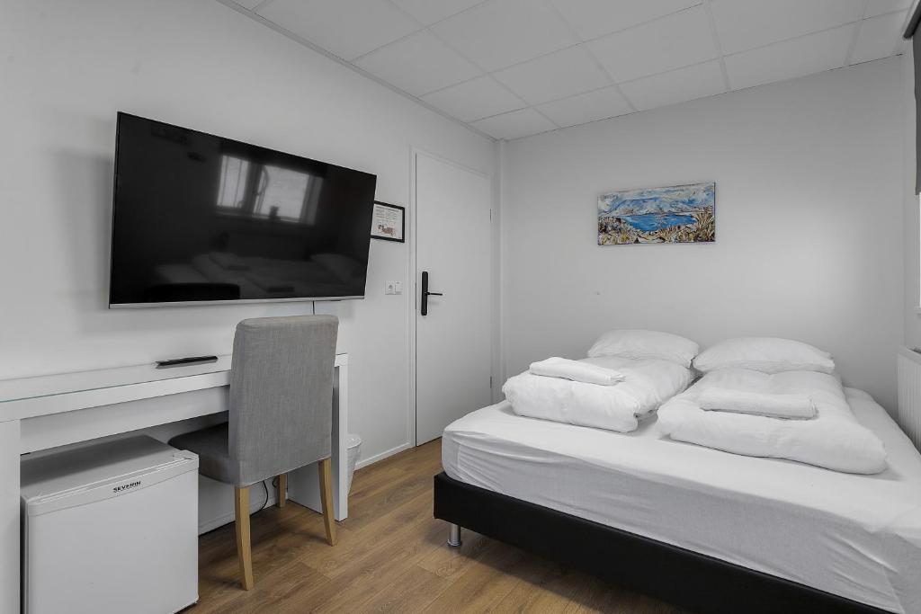 Postel nebo postele na pokoji v ubytování Bank Guesthouse by KEF Airport