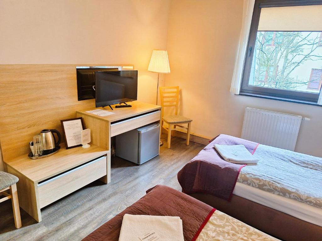 Posteľ alebo postele v izbe v ubytovaní B & B Tomula