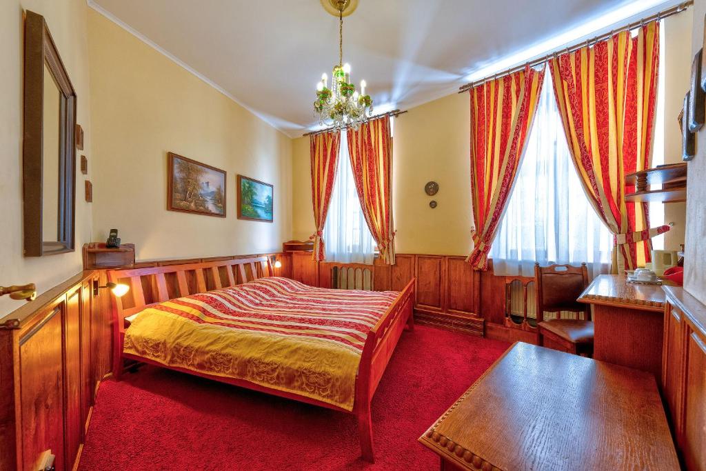 Postel nebo postele na pokoji v ubytování Betlem Club Hotel