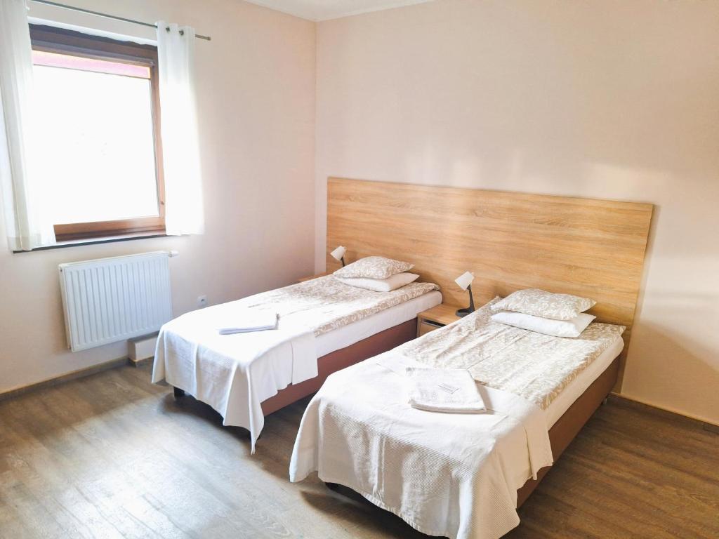 Posteľ alebo postele v izbe v ubytovaní B & B Tomula