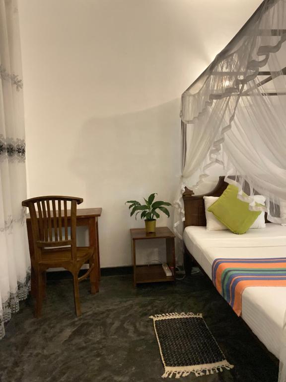 Postel nebo postele na pokoji v ubytování Coconut Grove - Midigama