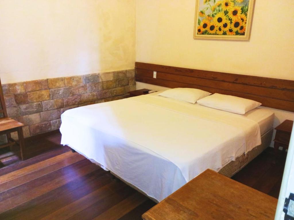 Postel nebo postele na pokoji v ubytování Quarto De Casal Econômico