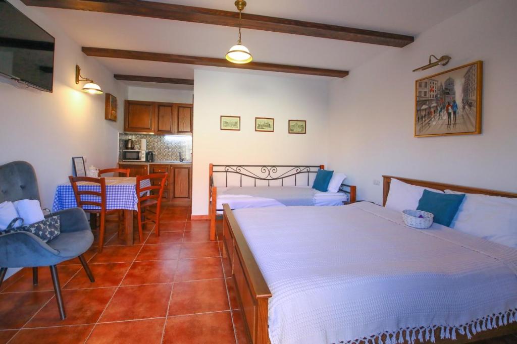 Postel nebo postele na pokoji v ubytování AMA Guest House