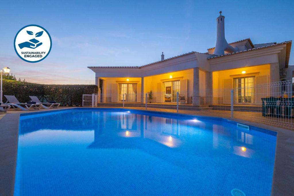 a large swimming pool in front of a house at Villa Rose Bay by Algarve Vacation in Albufeira